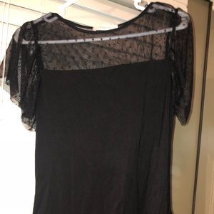 Black top with sheer panel